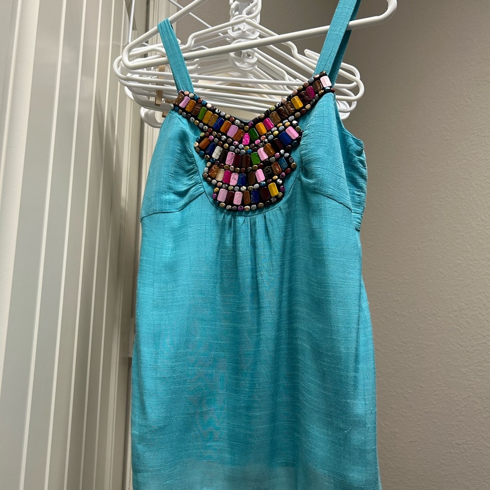 Bright teal tank top with embellishment